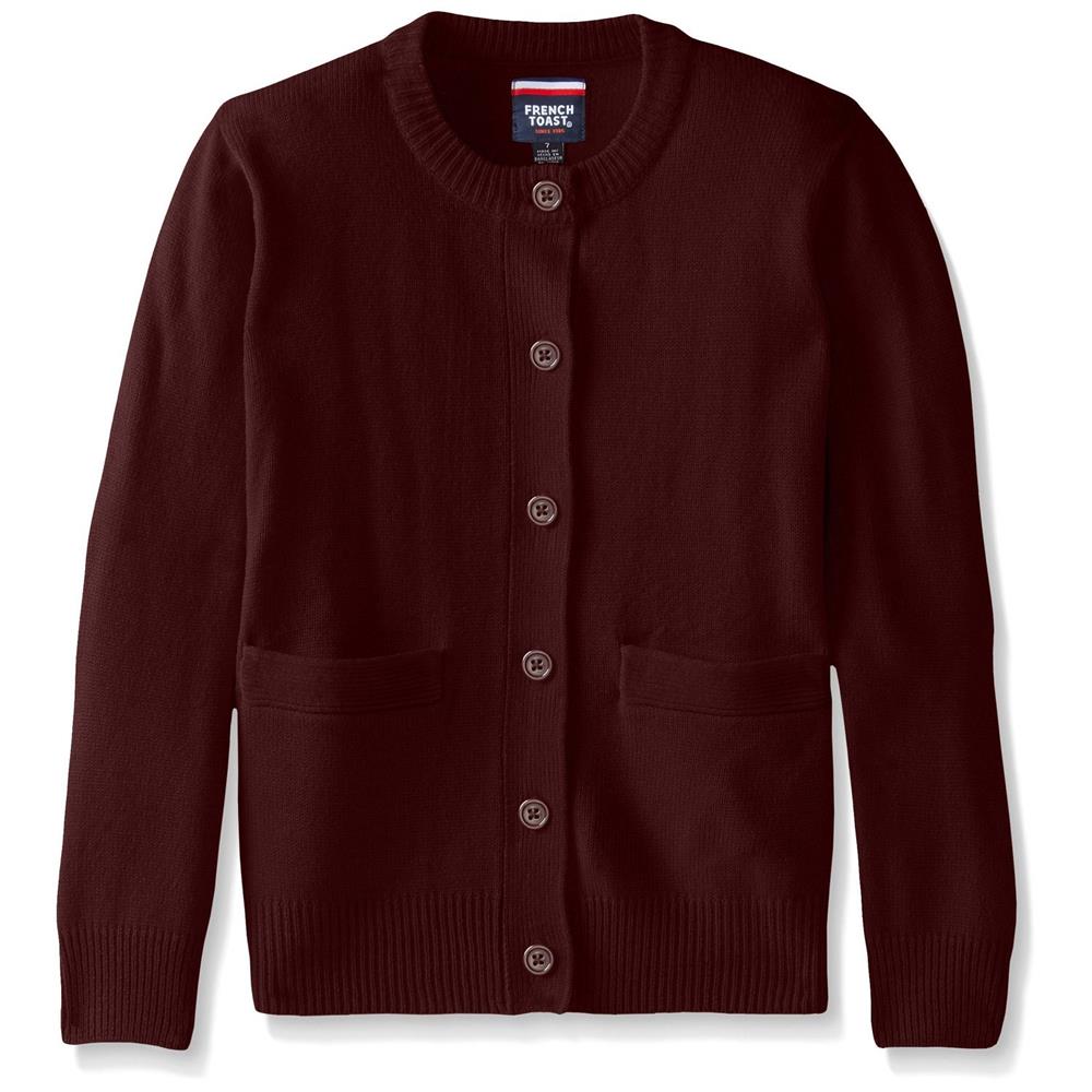 Białe mikrocząsteczki akrylu wypłukane z pranej bluzki w sitku pralki